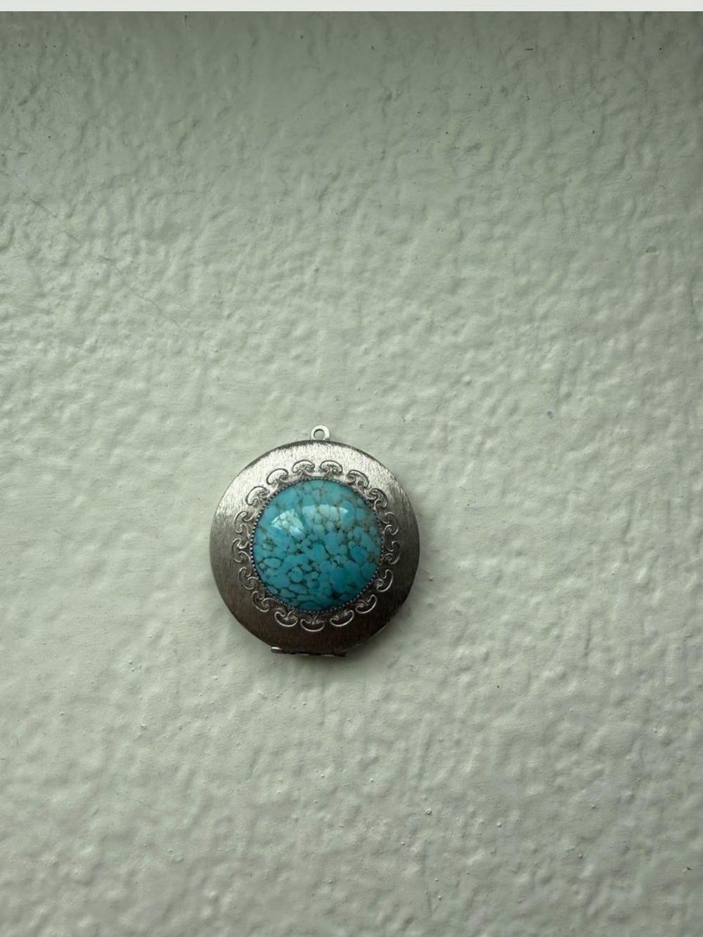 Round silver-tone locket pendant